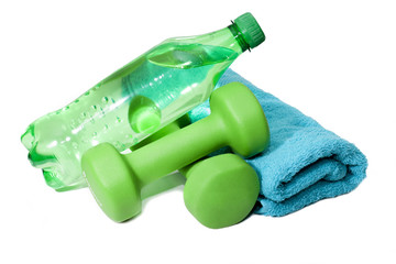 Dumbbells and water bottle, towel on a white background.