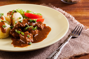 Goulash with boiled potatoes