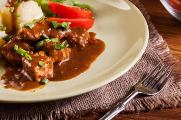Goulash with boiled potatoes