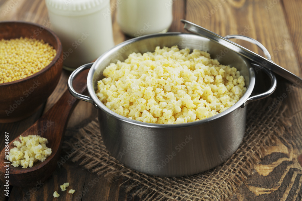 Wall mural millet porridge in a metal pan