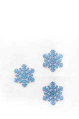 blue snow flakes on bright background
