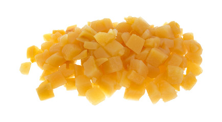 Cubed cooked rutabagas on a white background