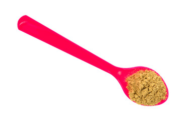 Pink spoon with stir fry seasoning on a white background