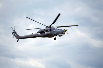 Naklejka na ściany i meble Combat helicopter in flight