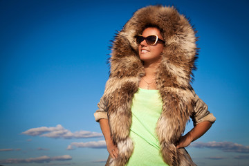 Winter Woman in Fur Coat. A photo of beautiful girl is in fur cl
