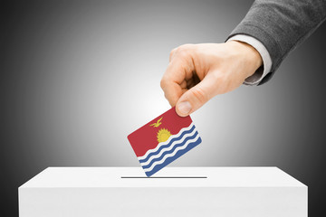 Voting concept - Male inserting flag into ballot box - Kiribati