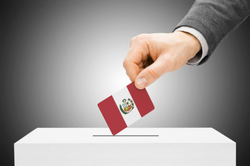 Voting concept - Male inserting flag into ballot box - Peru