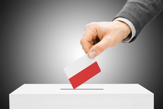 Voting concept - Male inserting flag into ballot box - Poland