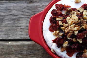 Brie Cranberry and walnuts in a pot ready for the oven