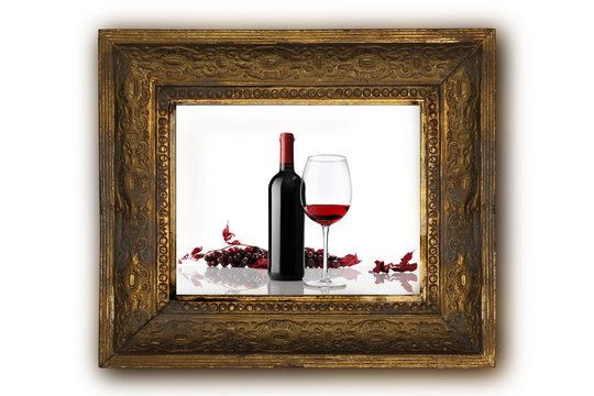 wine bottle with glass and bunch of red grapes on old classic wo