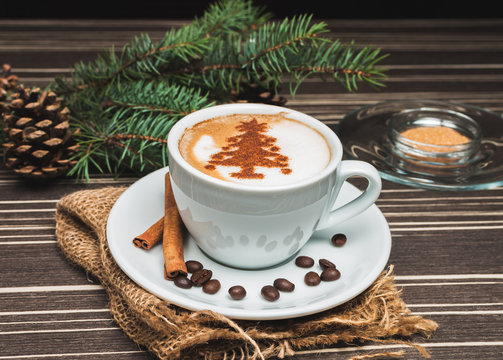 Christmas cup of cappuccino with cinnamon