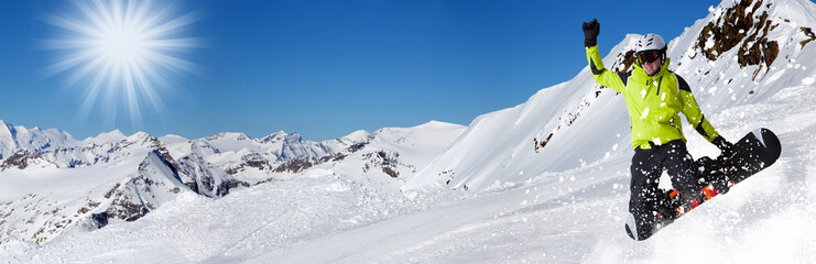 Fototapeta na wymiar Snowboarder in high mountains