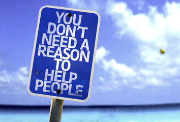 You Don't Need a Reason to Help People sign with a beach