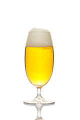 Beer into glass isolated on white