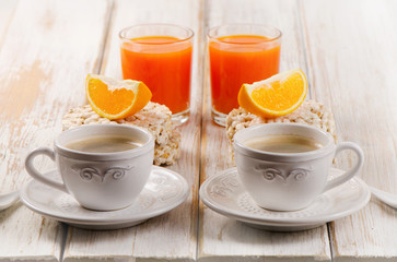 Healthy breakfast - two cup of coffee, orange juice