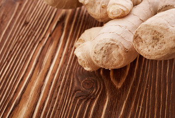 Ginger root sliced on wooden table