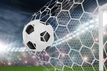 soccer ball in goal net