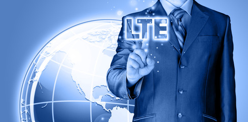 businessman is pushing his finger on lte button
