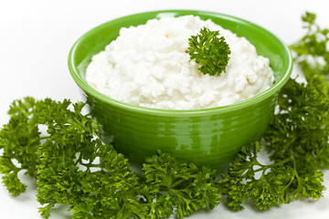 Cottage cheese with parsley. Selective focus.