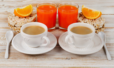 Healthy breakfast with two   coffee cup and  juice