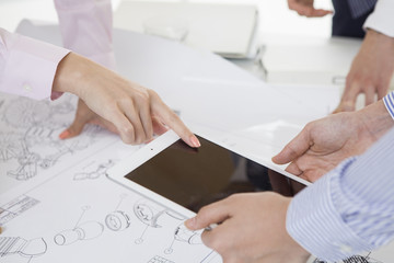 Woman pointing to the tablet