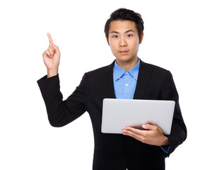 Businessman use laptop and finger point up