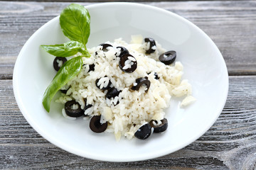 Olives with  rice and  grated cheese