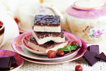 three pieces of shortcake cake with nuts and chocolate