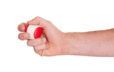 Male hand with a red and white ball