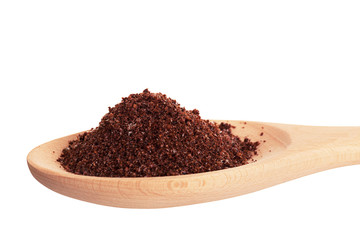 Sumac spice in a wooden spoon, is isolated on a white background