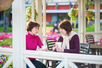 Mother and daughter in cafe