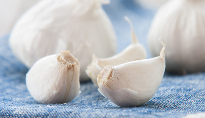 Garlic on the blue background close up