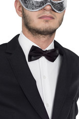 Handsome man in mask, expensive suit, black bow tie