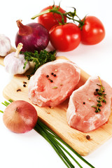 Fresh pork meat steaks with vegetables