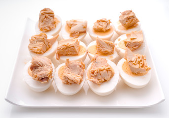 Obraz na płótnie Canvas Cut boiled eggs with tuna