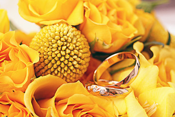 wedding rings wedding flowers yellow