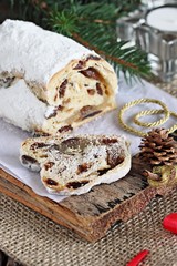 Traditional German Christmas cake ( Stollen ) on a wooden table