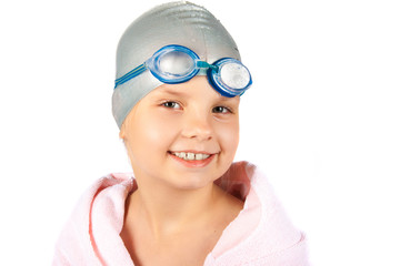 Portrait of a young girl in goggles and swimming cap. Isolated o