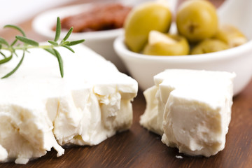 Feta cheese with olives, sun dried tomatoes and fresh herbs