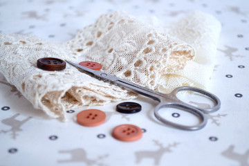 Scissors and buttons with lace ribbon