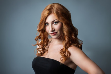 beautiful girl with red curly hair