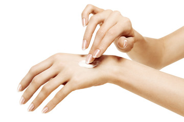 moisturizer cream on female hands on a white background