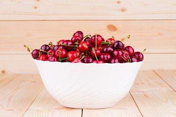 Cherries on wooden table