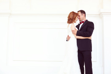 Bridal couple kissing lovely wedding day