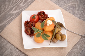 Appetizer with tomato, mozzarella and olives
