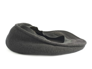 Black woven beret flat-crowned hat isolated
