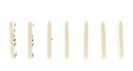 Multiple domino pieces standing in a row