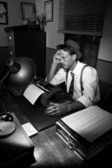 Exhausted reporter working late at night