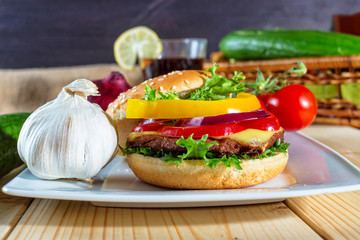 hamburger and drink with slice of lemon