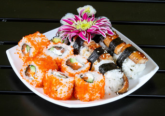 set of sushi on a white plate